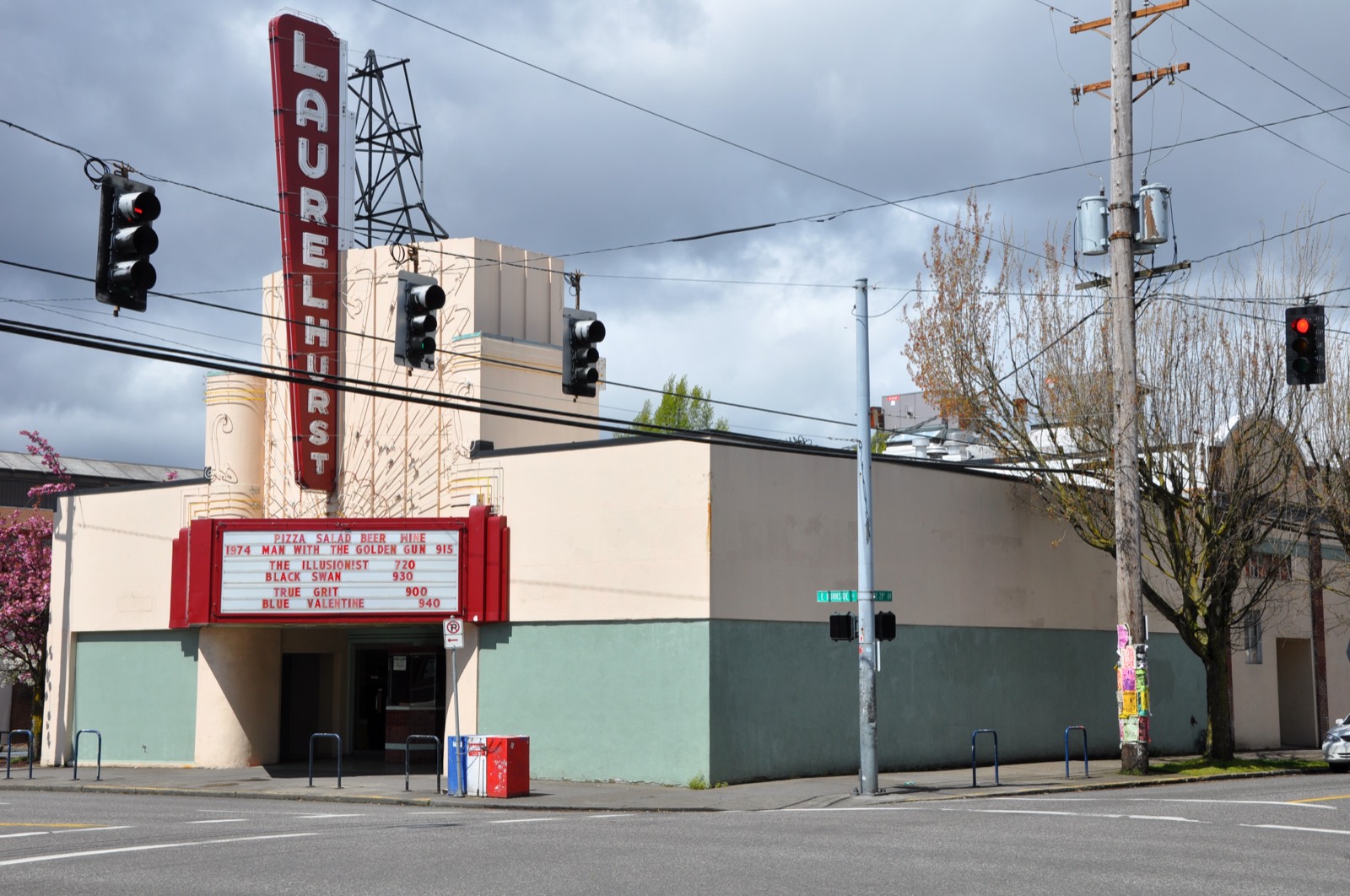 The Laurelhurst Theater's curved corner facade and neon sign on East Burnside