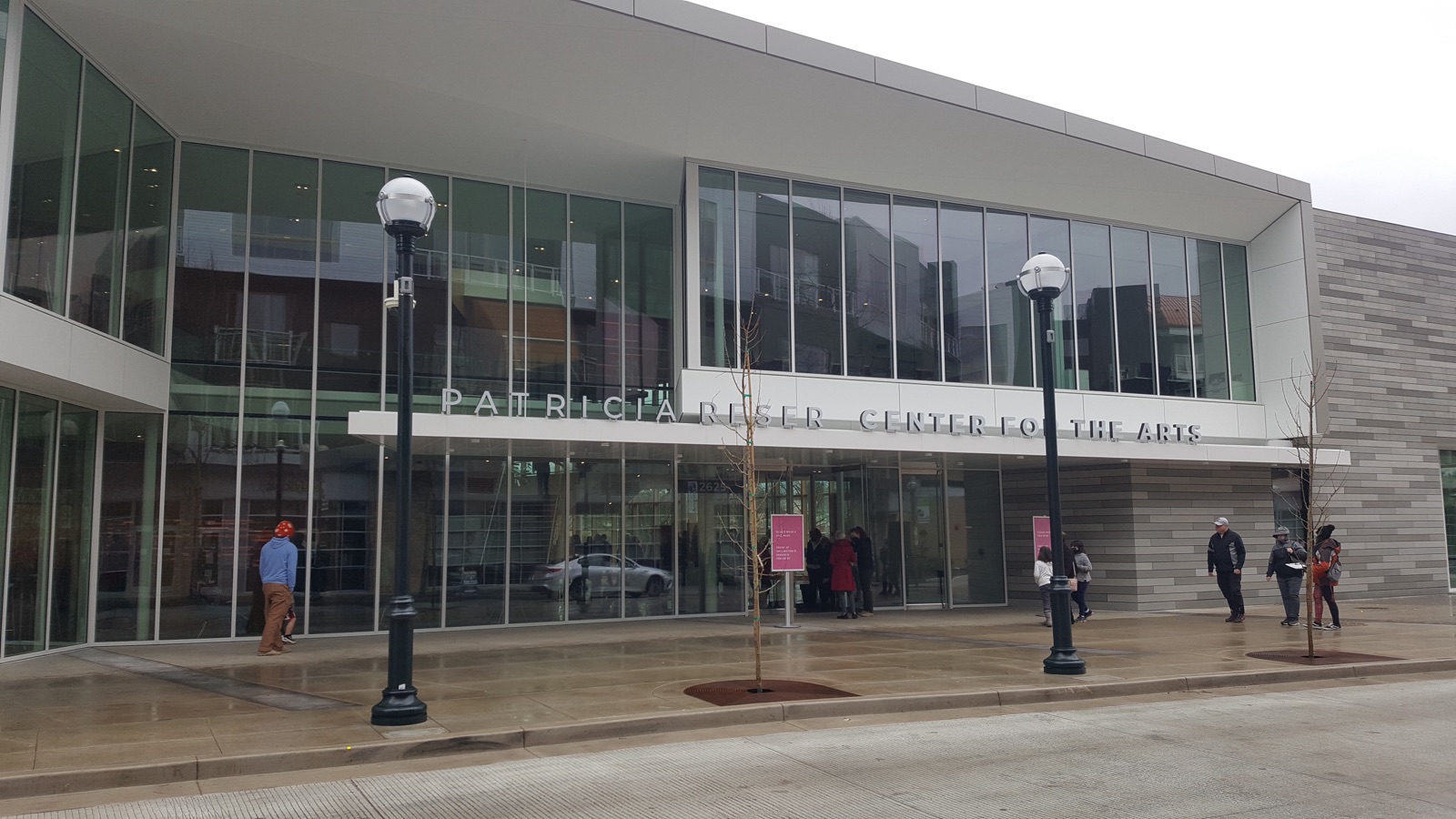 The glass front of the Patricia Reser Center for the Arts in Beaverton, its name across the facade