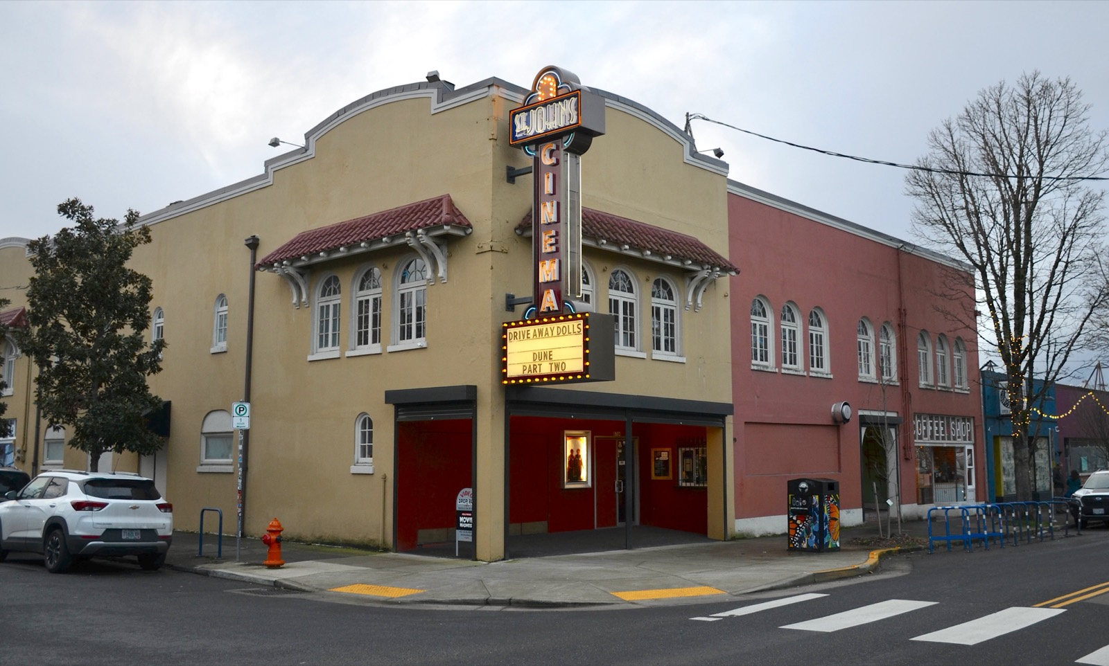 The St. Johns Cinema's neon blade sign and marquee on N Lombard Street
